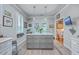 Kitchen island with white quartz countertop and gray cabinets at 1374 Black River Dr, Mount Pleasant, SC 29466