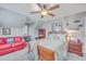 Charming bedroom with a double bed and red couch at 1374 Black River Dr, Mount Pleasant, SC 29466