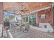 Spacious covered patio with comfortable seating and dining area, perfect for outdoor entertaining at 1374 Black River Dr, Mount Pleasant, SC 29466