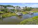 Aerial view of waterfront homes with private docks and boats at 1374 Black River Dr, Mount Pleasant, SC 29466