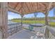 Relaxing waterfront pergola with table and chairs at 1374 Black River Dr, Mount Pleasant, SC 29466