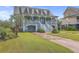 Two-story house with light blue exterior, white trim, and a double garage at 1374 Black River Dr, Mount Pleasant, SC 29466