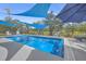 Inviting pool with blue shade sails and patio seating at 1374 Black River Dr, Mount Pleasant, SC 29466