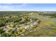 Aerial view of a community near the water, featuring houses and marshland at 1374 Black River Dr, Mount Pleasant, SC 29466