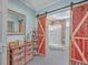 Bathroom with barn doors, walk-in shower, and modern vanity at 1374 Black River Dr, Mount Pleasant, SC 29466