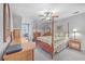 Upstairs bedroom with a four-poster bed and ceiling fan at 1374 Black River Dr, Mount Pleasant, SC 29466