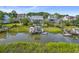 Private boat dock with covered seating area and lift for easy boat access at 1374 Black River Dr, Mount Pleasant, SC 29466