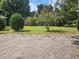 Spacious front yard with mature trees and landscaping at 1132 Brownswood Rd, Johns Island, SC 29455
