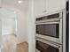 Stainless steel double oven and microwave in a modern kitchen at 1706 Cultivation Ln # 539, Mount Pleasant, SC 29466