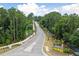 Community entrance lined with trees and signage at 1706 Cultivation Ln # 539, Mount Pleasant, SC 29466