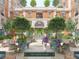 Landscaped courtyard with seating and a fountain at 609 King St # 740, Charleston, SC 29403