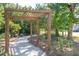 Wooden pergola shaded walkway with bench, perfect for relaxing at 1635 Siloh Dr # 483, Mount Pleasant, SC 29466