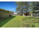 Backyard view of home with shed and large lawn at 3264 Heaton Dr, Ladson, SC 29456