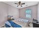 Simple bedroom with ceiling fan, window, and carpet flooring at 3264 Heaton Dr, Ladson, SC 29456