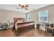 Bedroom with a wooden sleigh bed and ceiling fan at 3264 Heaton Dr, Ladson, SC 29456
