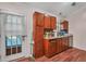 Kitchen with wood cabinets and access to backyard at 3264 Heaton Dr, Ladson, SC 29456