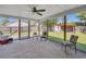 Relaxing screened porch with ceiling fan, chairs, and view of backyard at 3264 Heaton Dr, Ladson, SC 29456