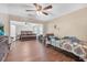 Spacious bedroom with wood flooring, ceiling fan, and large windows at 3264 Heaton Dr, Ladson, SC 29456