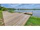 Wooden community dock with multiple piers and a bench overlooking the lake at 226 Topsaw Ln, Moncks Corner, SC 29461