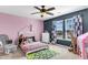 Charming bedroom with pink walls, a playful decor, and ample natural light at 226 Topsaw Ln, Moncks Corner, SC 29461