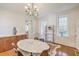 Dining room featuring a marble table, chandelier, and hardwood floors at 11 George St # Abcd, Charleston, SC 29401