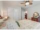 Charming bedroom with a floral quilt, wooden dresser, and double door closet at 156 Keaton Brook Dr, Summerville, SC 29485