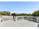 Spacious rooftop deck with white railings, offering scenic neighborhood views at 512 Carolina Blvd, Isle of Palms, SC 29451