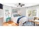 Bright bedroom with a queen bed, hardwood floors, and ample natural light at 512 Carolina Blvd, Isle of Palms, SC 29451
