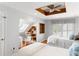 Charming bedroom with two twin beds, built-in shelves, and hardwood floors at 512 Carolina Blvd, Isle of Palms, SC 29451