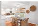 Bright dining area with farmhouse table and wicker chairs at 512 Carolina Blvd, Isle of Palms, SC 29451