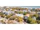 Aerial view of beach neighborhood, highlighting a home with private pool and ocean views at 512 Carolina Blvd, Isle of Palms, SC 29451