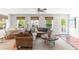 Comfortable living room features a sectional sofa, hardwood floors, and large windows at 512 Carolina Blvd, Isle of Palms, SC 29451