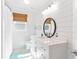Bathroom with shiplap walls, white vanity, and a walk-in shower at 512 Carolina Blvd, Isle of Palms, SC 29451