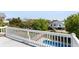 Elevated deck overlooks the backyard, pool, and surrounding homes at 512 Carolina Blvd, Isle of Palms, SC 29451