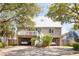 Two-story home with metal roof and parking at 512 Carolina Blvd, Isle of Palms, SC 29451