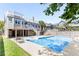 Large backyard with a sparkling blue pool and patio furniture at 512 Carolina Blvd, Isle of Palms, SC 29451