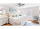 King size bed in bright bedroom with hardwood floors and ceiling fan at 512 Carolina Blvd, Isle of Palms, SC 29451