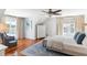 Main bedroom with hardwood floors, a king bed, and access to a private deck at 512 Carolina Blvd, Isle of Palms, SC 29451
