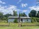 Quaint single story home with mature trees and needs renovations at 306 Ackerman St, Walterboro, SC 29488