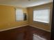 Spacious bedroom with hardwood floors and two windows with blinds at 1032 Greenhill Rd, Charleston, SC 29412