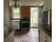 Kitchen with stainless steel appliances and access to the backyard at 1032 Greenhill Rd, Charleston, SC 29412