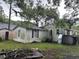 House exterior showing a white sided home with maroon shutters at 1032 Greenhill Rd, Charleston, SC 29412