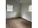 Simple bedroom with carpet and two windows with blinds at 1032 Greenhill Rd, Charleston, SC 29412