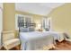 Two twin beds, wood floors, and ample natural light at 4358 Sea Forest Dr, Kiawah Island, SC 29455