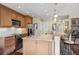 Spacious kitchen with granite countertops, stainless steel appliances, and light wood cabinets at 5532 Turtle Cove Ln, Kiawah Island, SC 29455