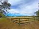 Large paddock with wooden fence and trees at 4714 Gold Cup Ln, Hollywood, SC 29449