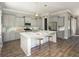 Modern kitchen with island, stainless steel appliances, and hardwood floors at 1089 Keeper Ln, Summerville, SC 29485