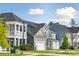 Attractive homes with gray siding and gray roofs, well-maintained lawns at 1089 Keeper Ln, Summerville, SC 29485
