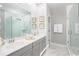 Elegant bathroom with double vanity, large shower, and marble floors at 1089 Keeper Ln, Summerville, SC 29485