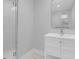 Clean bathroom with a white vanity and marble shower tiles at 4961 Baylor Ave, North Charleston, SC 29405